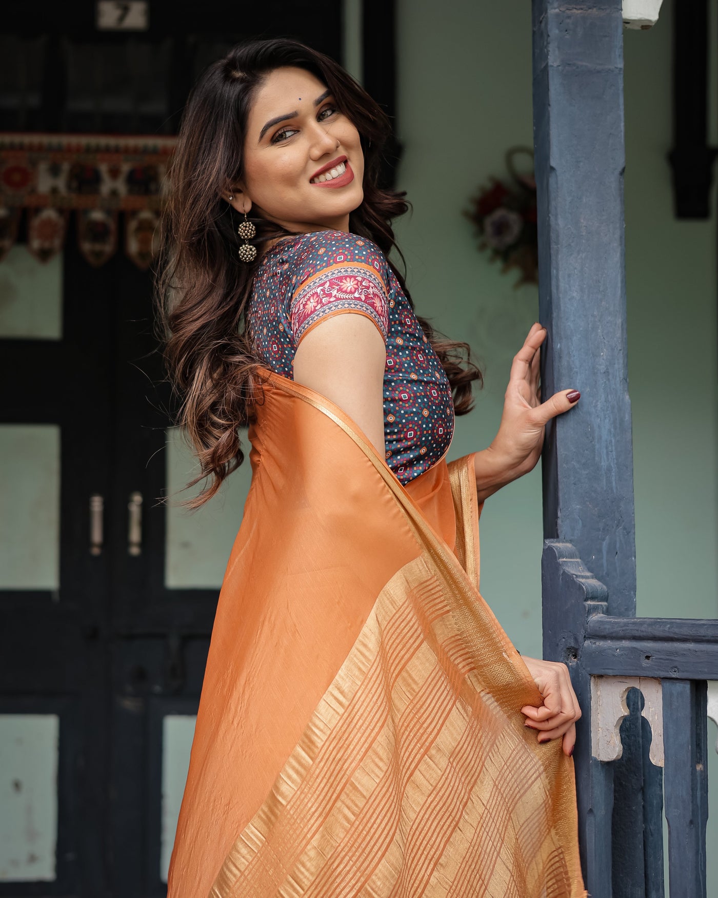 Elegant Tangerine Orange Plain Chiffon Saree with Gold Zari Border, Geometric Printed Blouse & Tassel Detailing