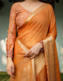 Sunset Orange Plain Chiffon Saree with Gold Zari Border, Floral Embroidered Blouse & Tassel Detailing