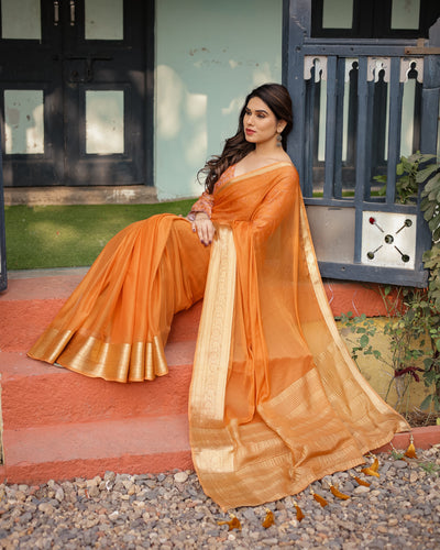 Sunset Orange Plain Chiffon Saree with Gold Zari Border, Floral Embroidered Blouse & Tassel Detailing