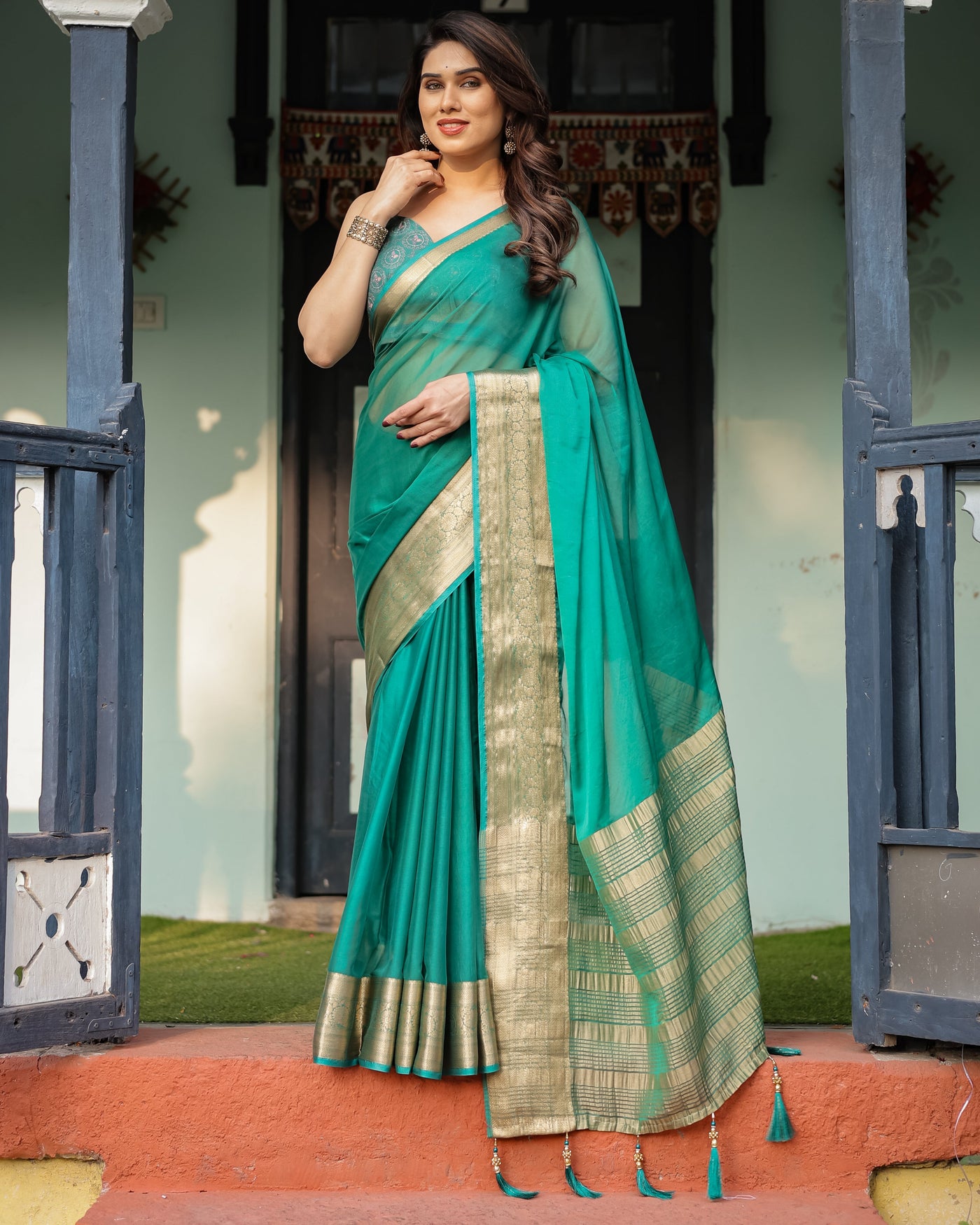 Elegant Sea Green Plain Chiffon Saree with Gold Zari Border, Paisley Printed Blouse & Tassel Detailing