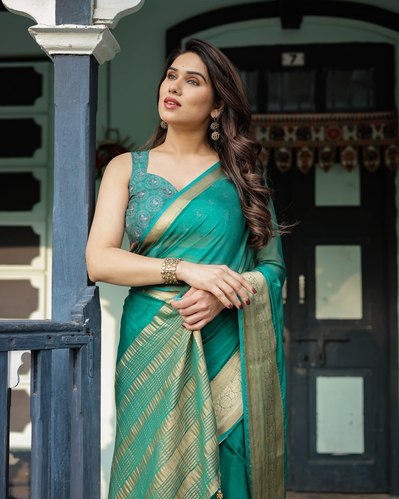 Elegant Sea Green Plain Chiffon Saree with Gold Zari Border, Paisley Printed Blouse & Tassel Detailing