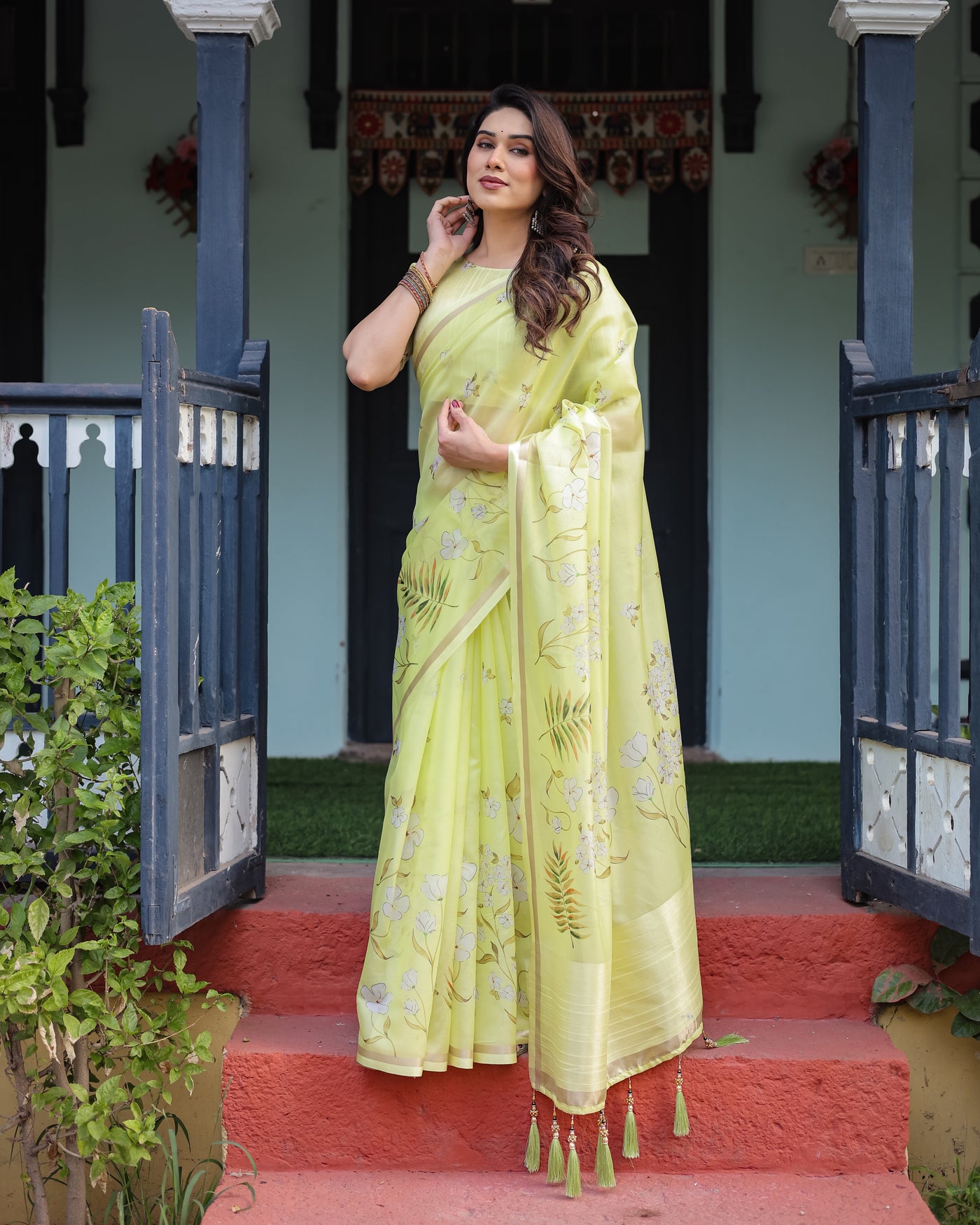 Lime Yellow Pastel Floral Print Premium Organza Saree with Zari Weave, and Tassel Details