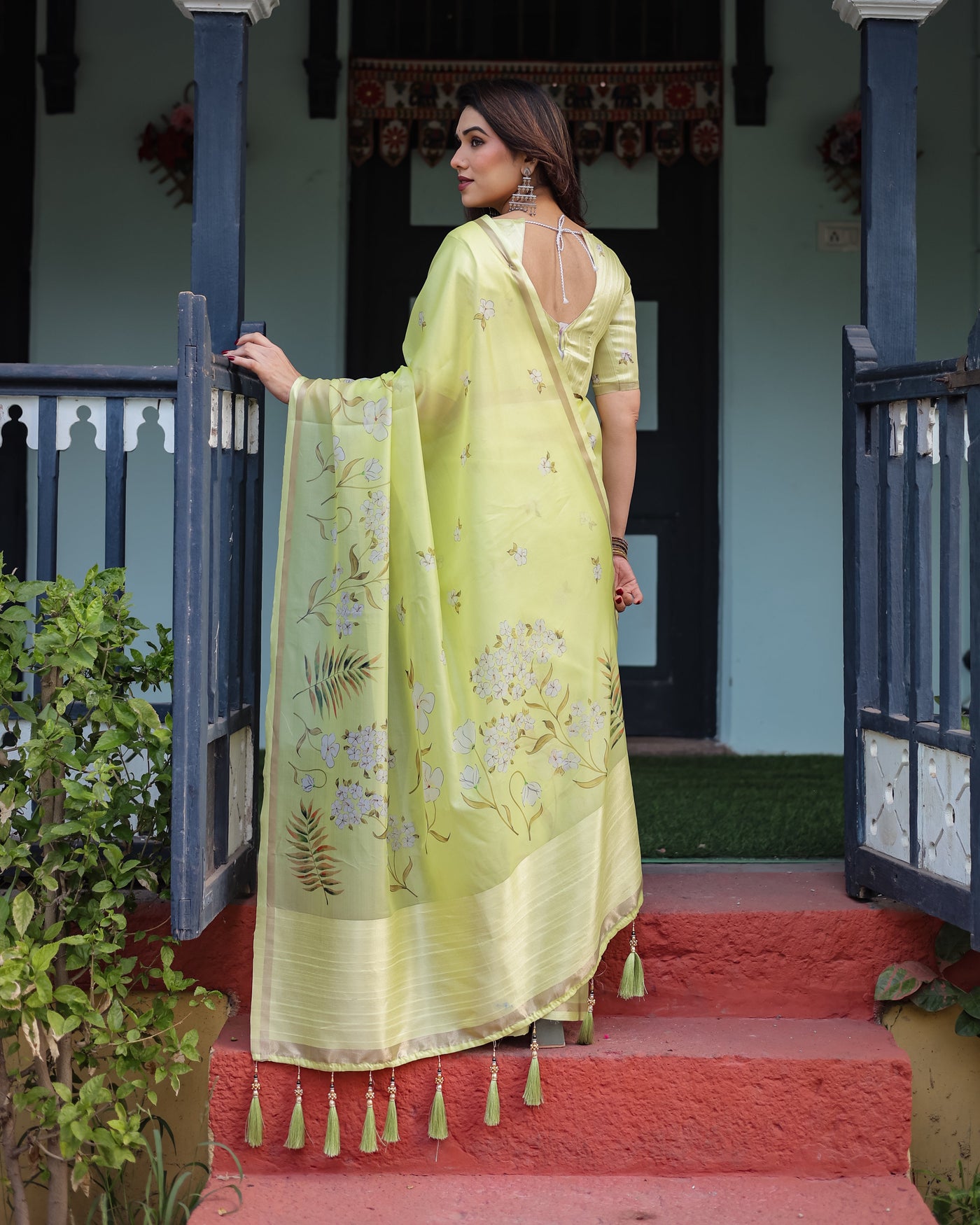 Lime Yellow Pastel Floral Print Premium Organza Saree with Zari Weave, and Tassel Details