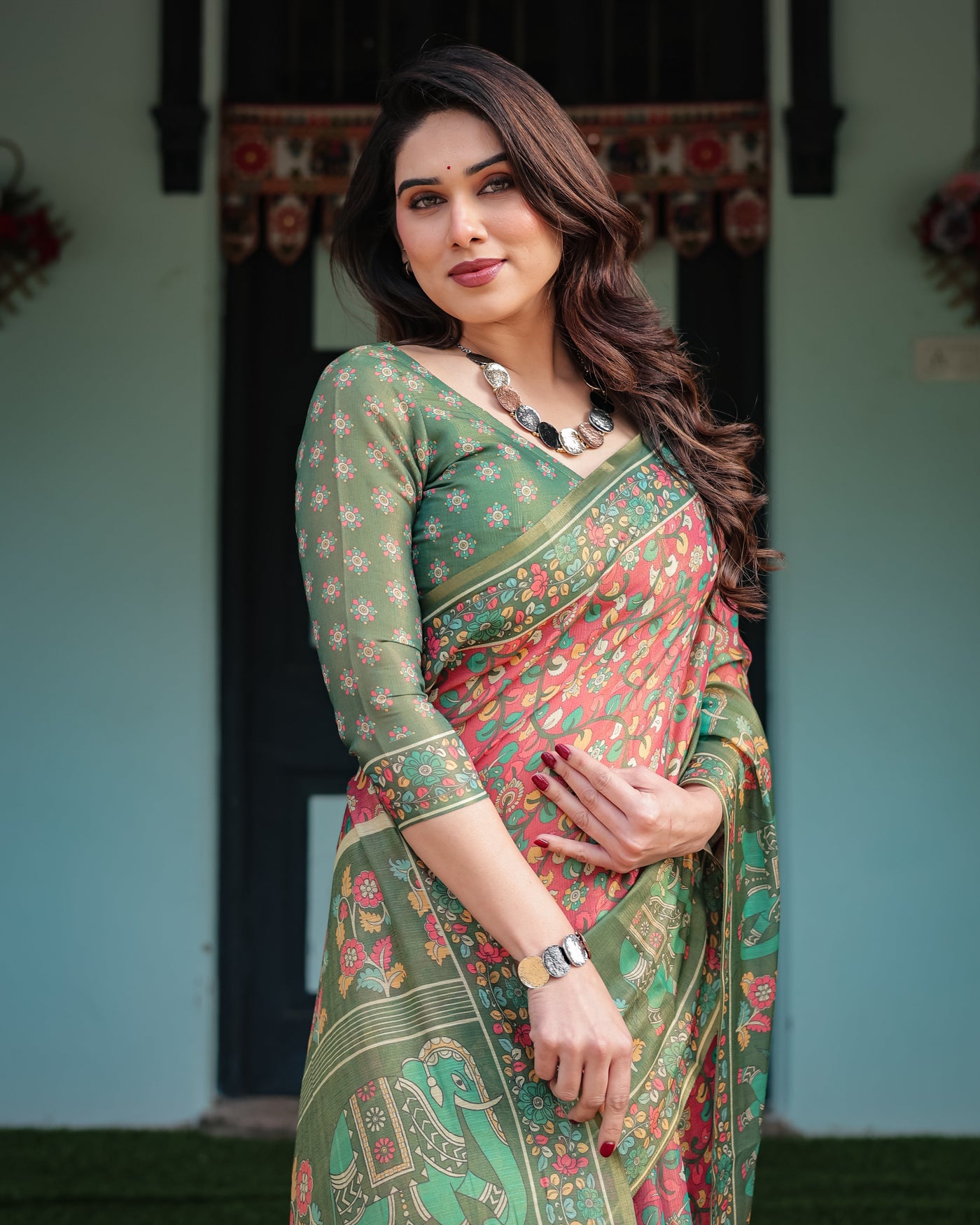 Green and Red Handloom Cotton-Linen Saree with Elephant Motifs and Floral Detailing