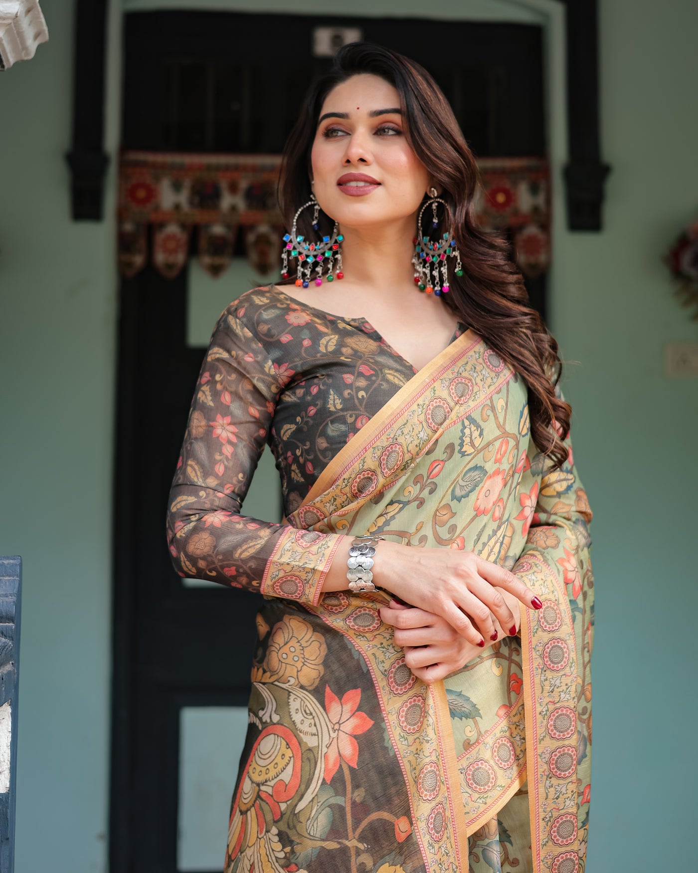 Sage Green with Bold Floral Motifs Linen Cotton Handloom Printed Saree, Vibrant Peacock Pallu, and Tassels