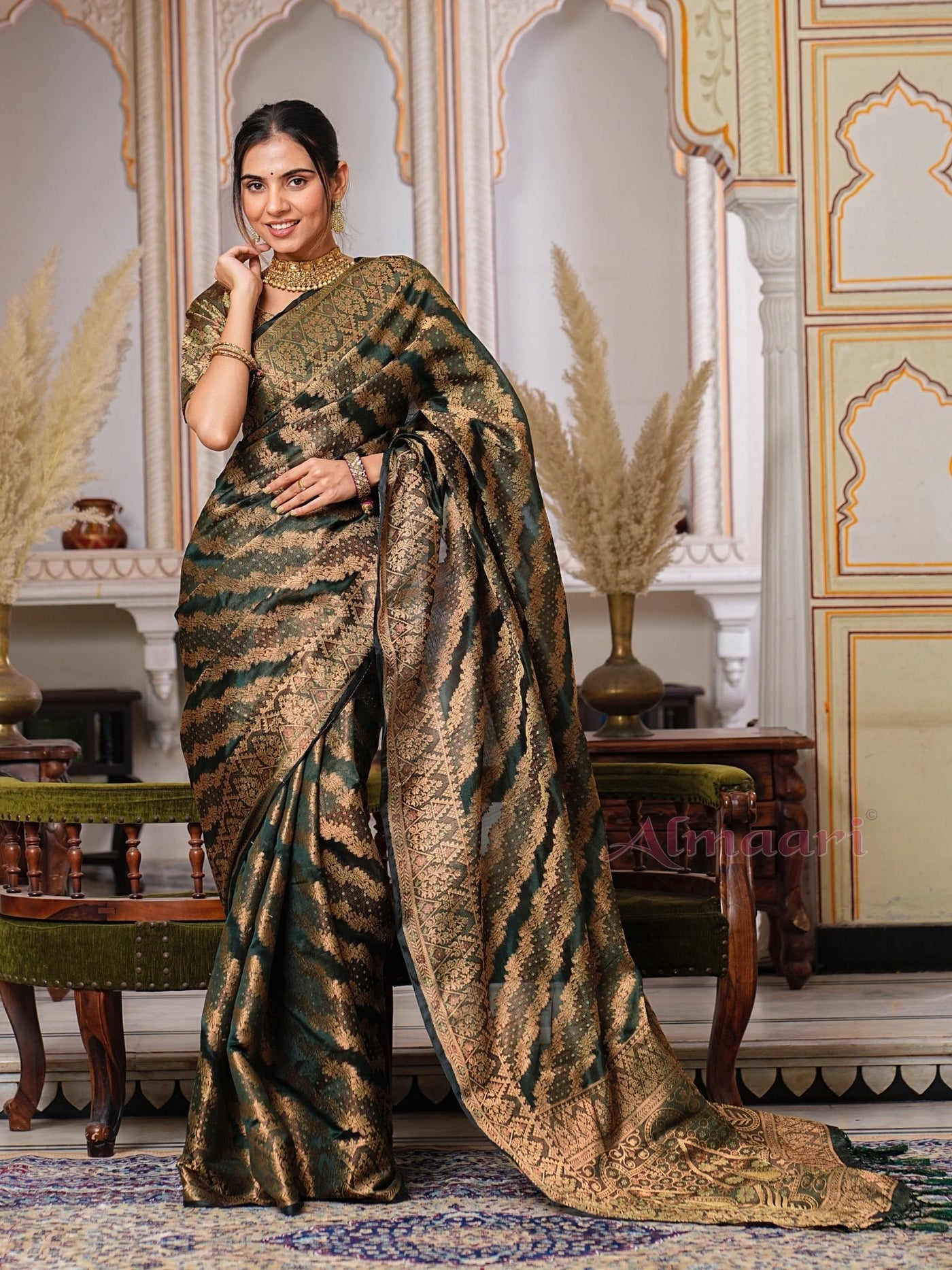 Dark Green Color Pure Organza Saree Adorned with Zari Weaving, Complete with Matching Blouse Piece - Almaari Fashion