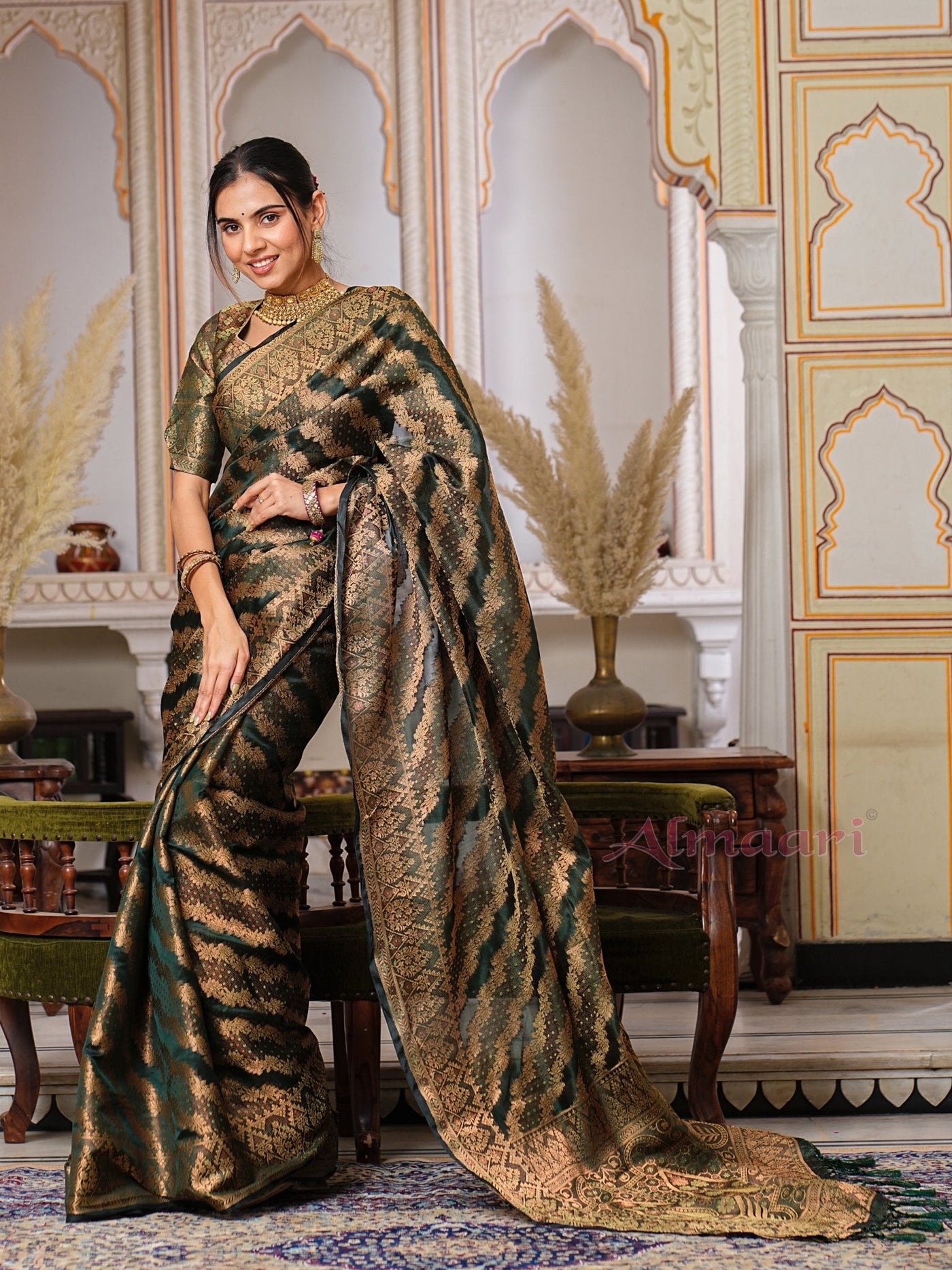 Dark Green Color Pure Organza Saree Adorned with Zari Weaving, Complete with Matching Blouse Piece - Almaari Fashion