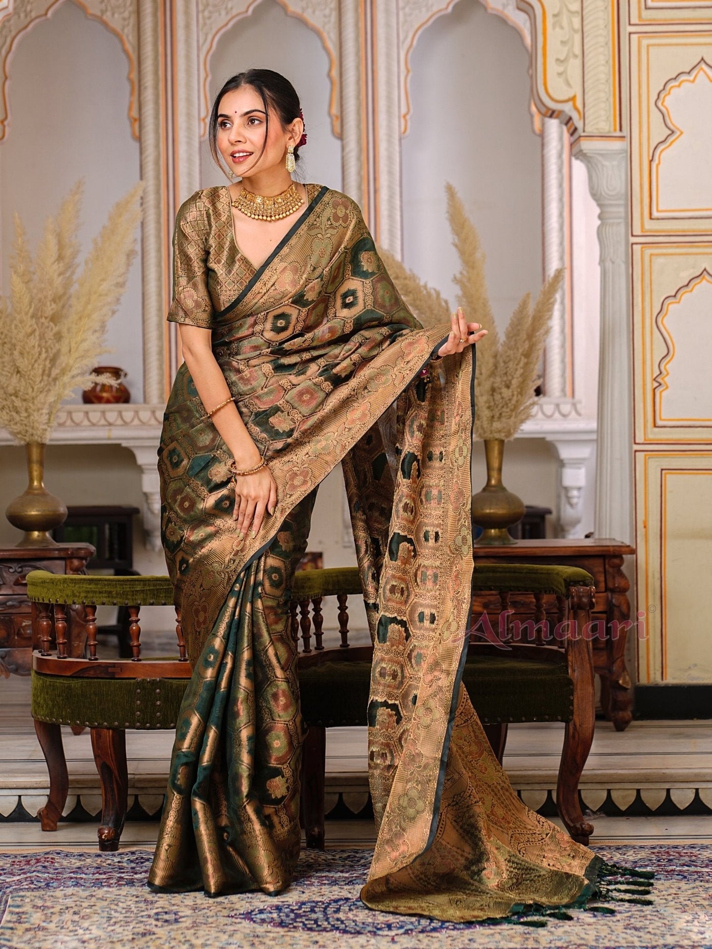 Dark Green Color Pure Organza Saree Adorned with Zari Weaving, Complete with Matching Blouse Piece - Almaari Fashion