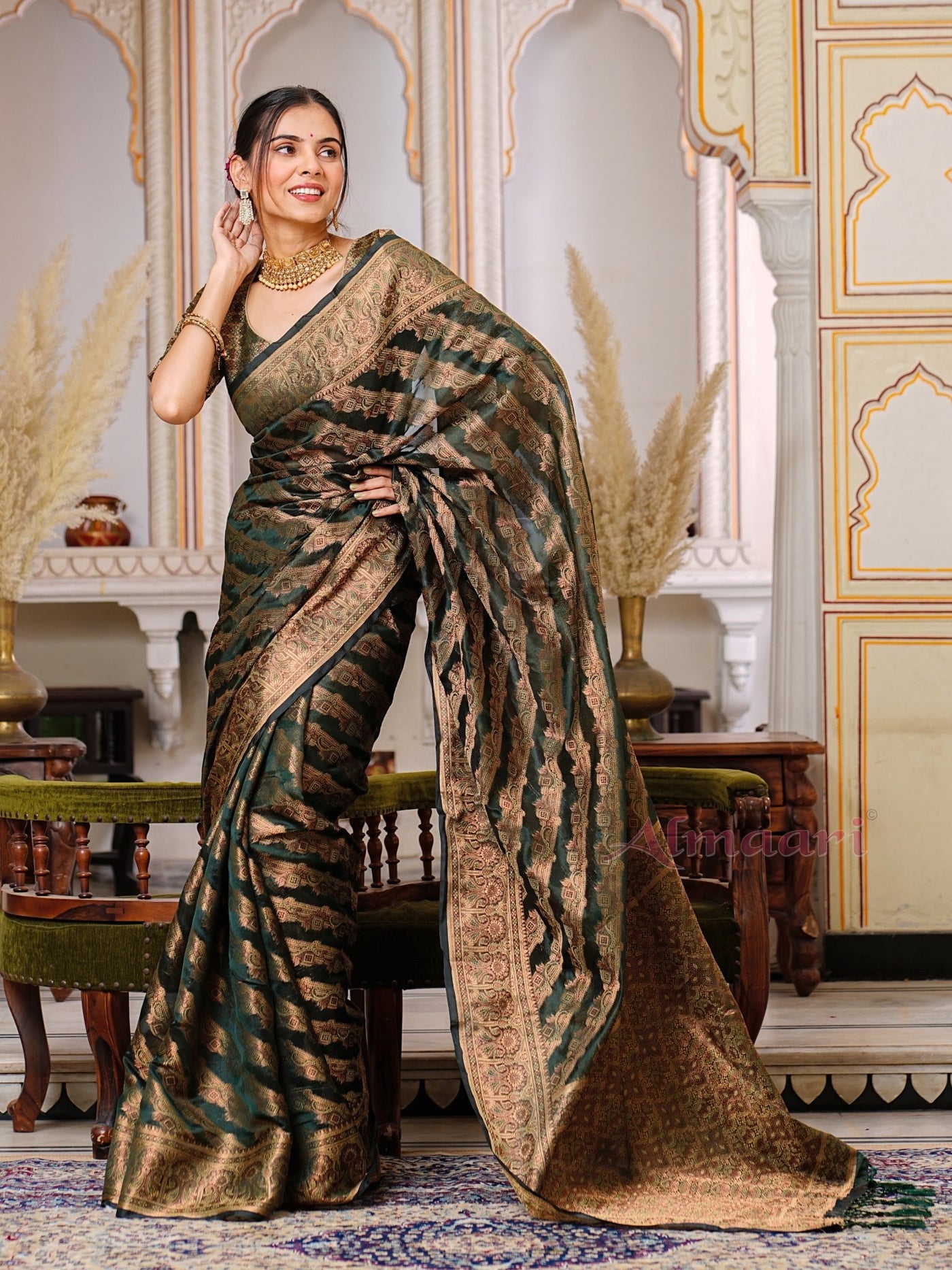 Dark Green Color Pure Organza Saree Adorned with Zari Weaving, Complete with Matching Blouse Piece - Almaari Fashion