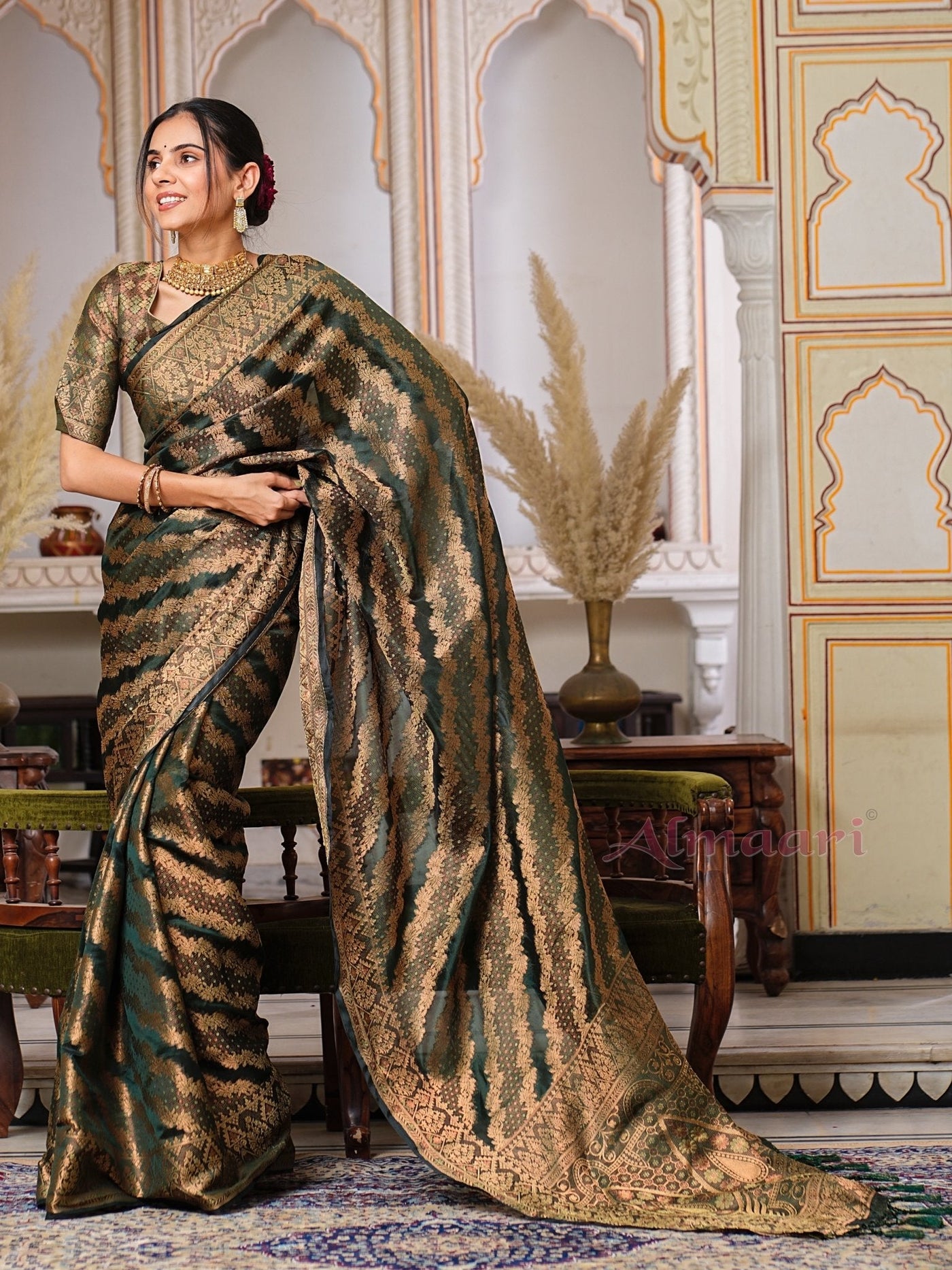 Dark Green Color Pure Organza Saree Adorned with Zari Weaving, Complete with Matching Blouse Piece - Almaari Fashion