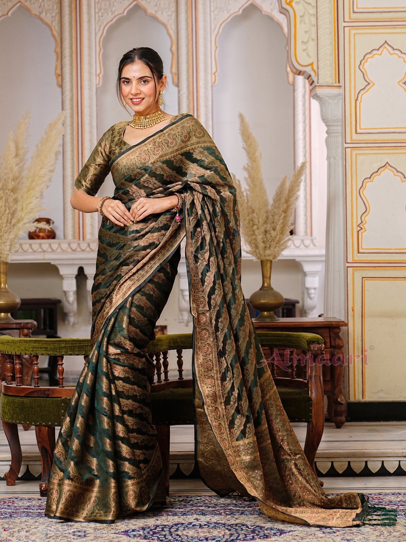 Dark Green Color Pure Organza Saree Adorned with Zari Weaving, Complete with Matching Blouse Piece - Almaari Fashion