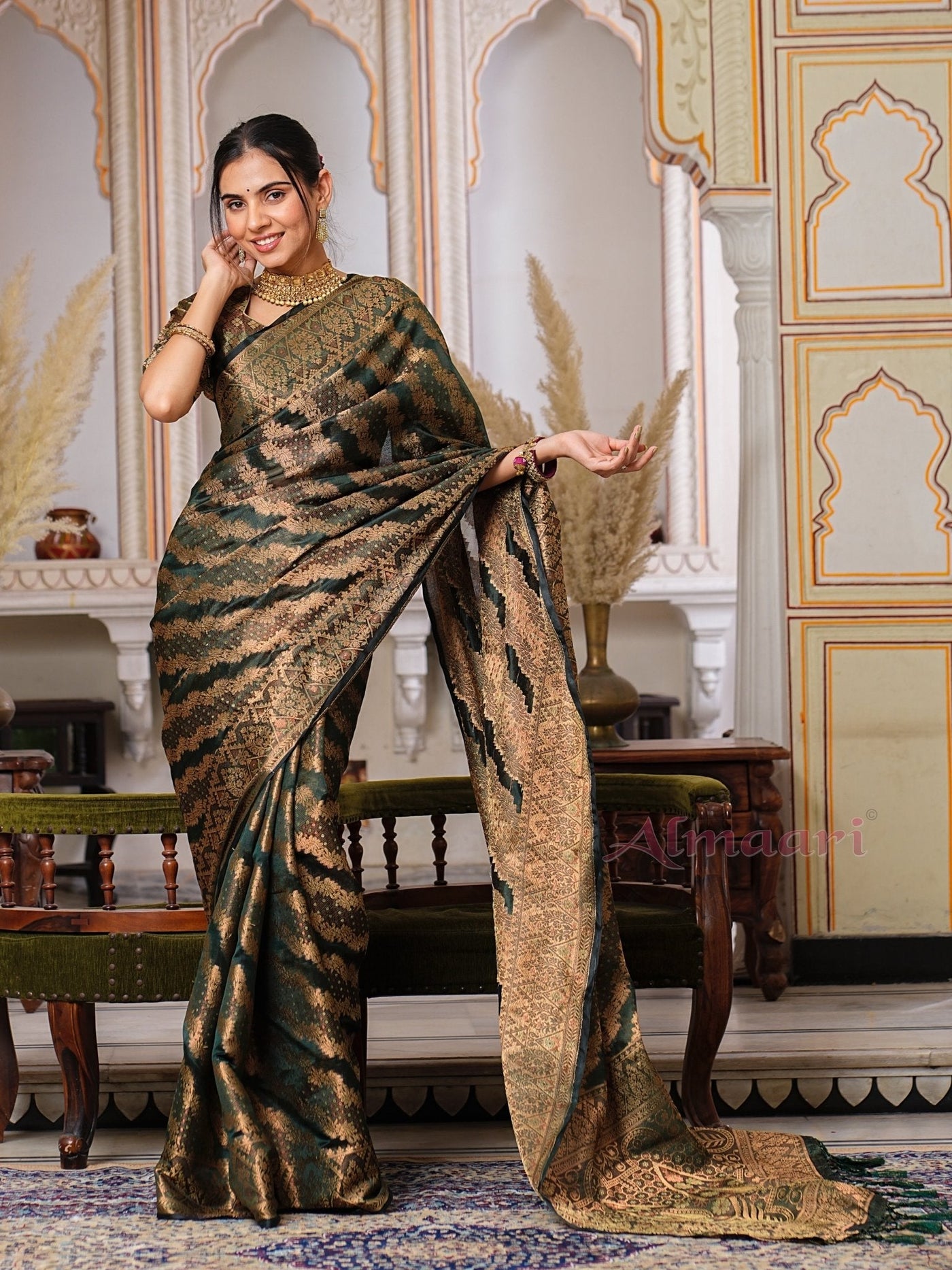 Dark Green Color Pure Organza Saree Adorned with Zari Weaving, Complete with Matching Blouse Piece - Almaari Fashion