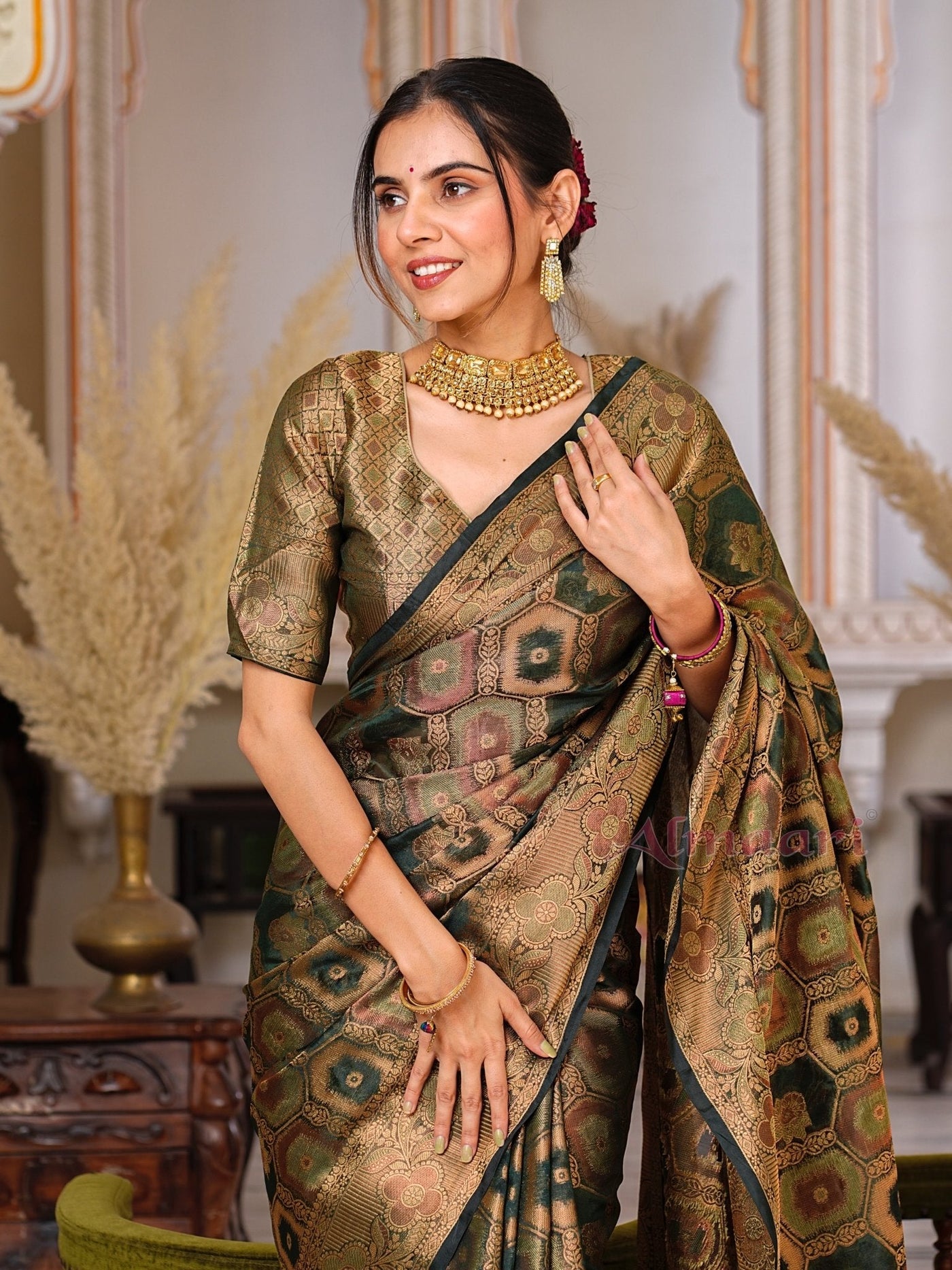 Dark Green Color Pure Organza Saree Adorned with Zari Weaving, Complete with Matching Blouse Piece - Almaari Fashion