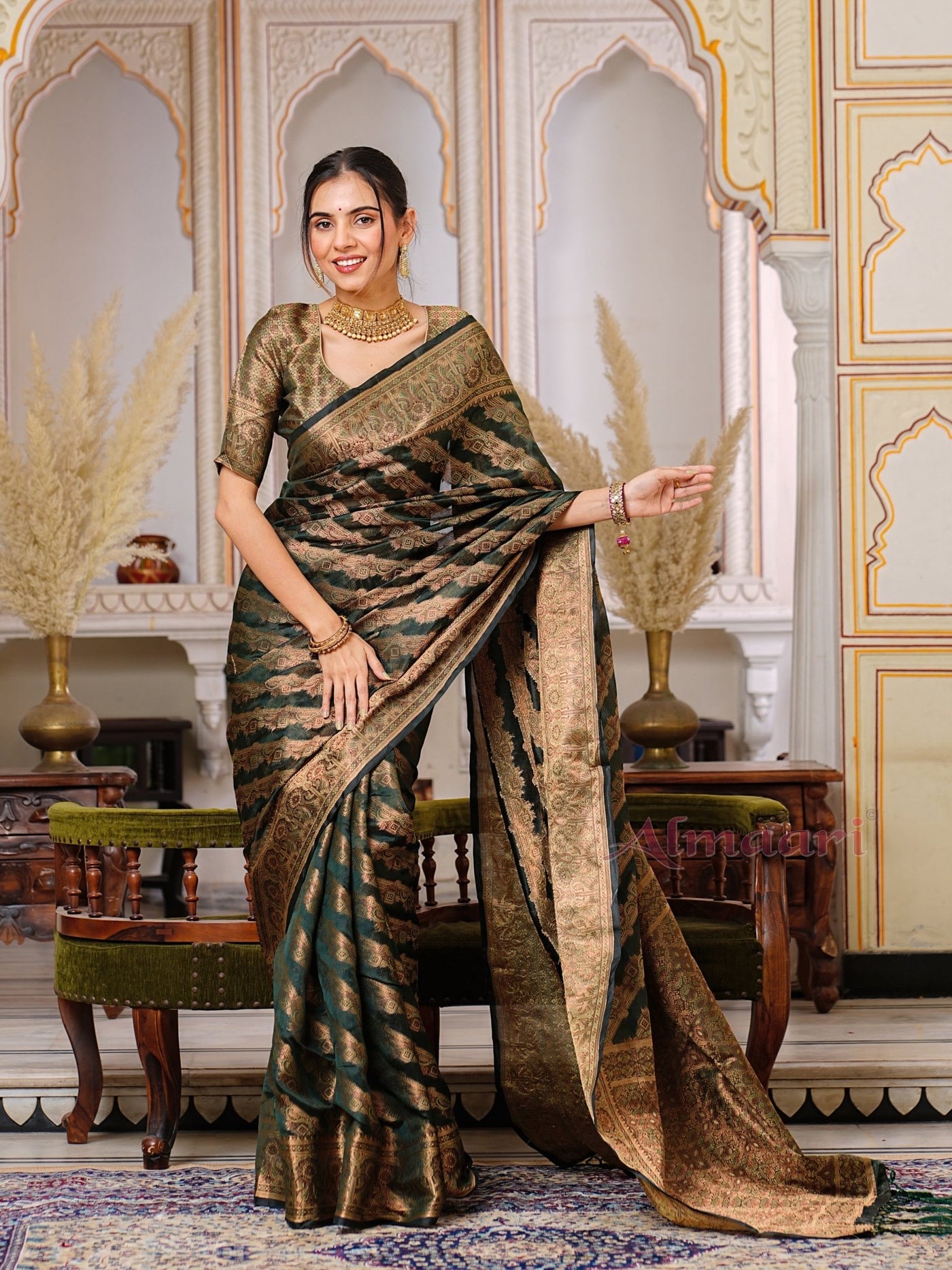 Dark Green Color Pure Organza Saree Adorned with Zari Weaving, Complete with Matching Blouse Piece - Almaari Fashion