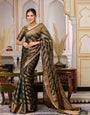 Dark Green Color Pure Organza Saree Adorned with Zari Weaving, Complete with Matching Blouse Piece