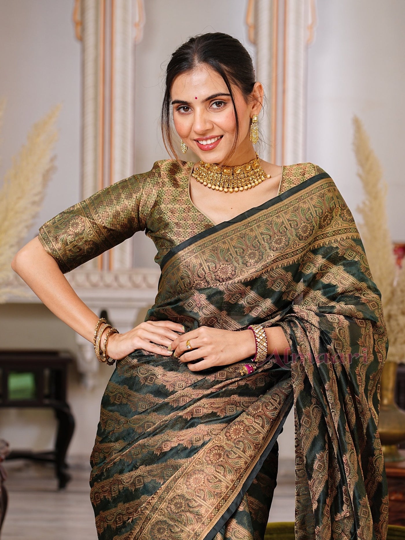 Dark Green Color Pure Organza Saree Adorned with Zari Weaving, Complete with Matching Blouse Piece - Almaari Fashion