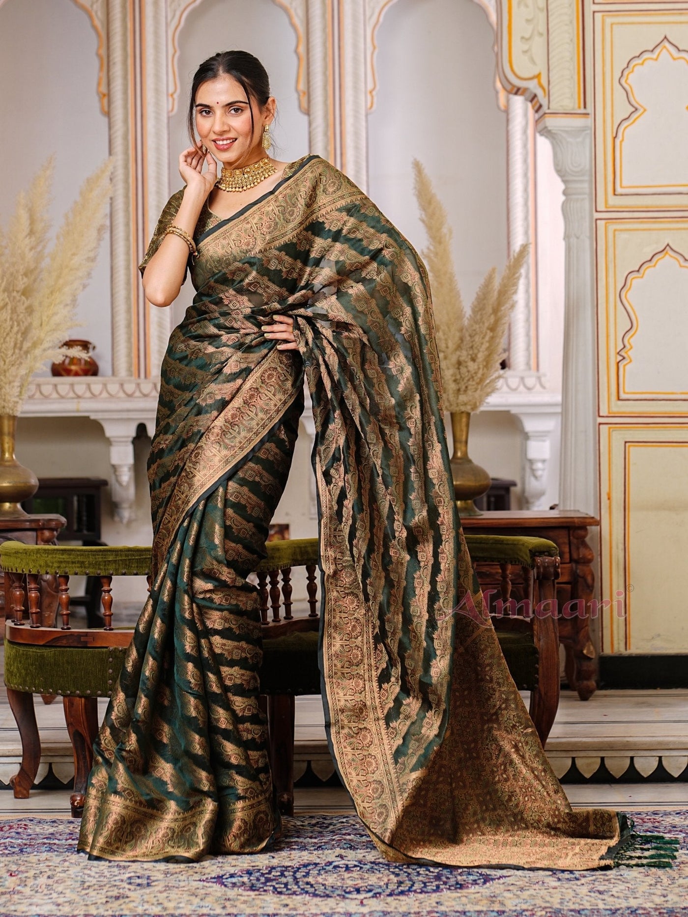 Dark Green Color Pure Organza Saree Adorned with Zari Weaving, Complete with Matching Blouse Piece - Almaari Fashion