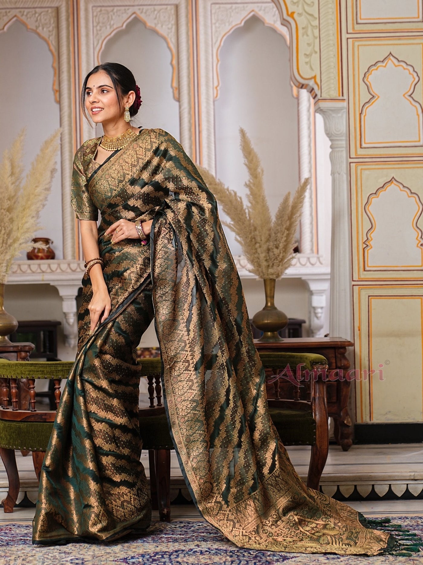 Dark Green Color Pure Organza Saree Adorned with Zari Weaving, Complete with Matching Blouse Piece - Almaari Fashion