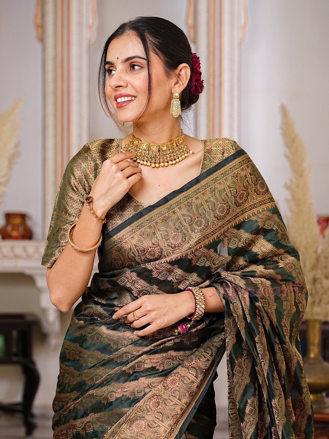 Dark Green Color Pure Organza Saree Adorned with Zari Weaving, Complete with Matching Blouse Piece - Almaari Fashion