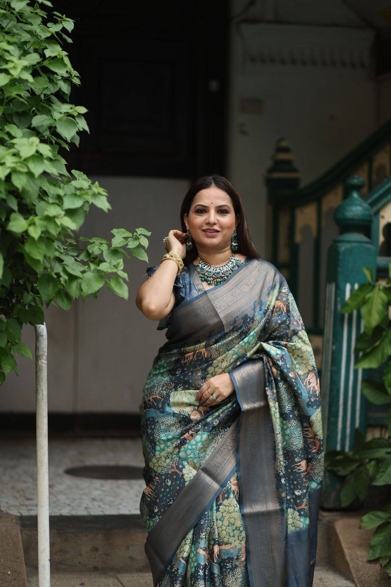 Elegant Teal Blue Banarasi Silk Saree with Forest-Inspired Motifs and Tassels