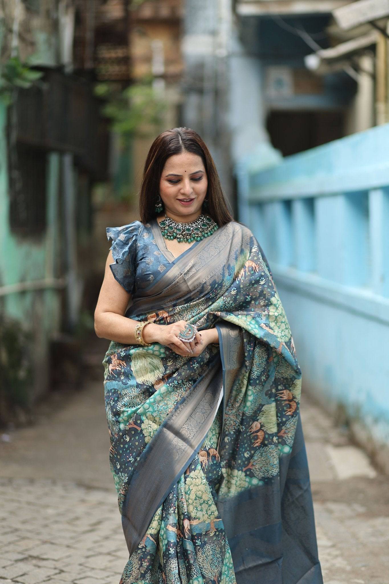 Elegant Teal Blue Banarasi Silk Saree with Forest-Inspired Motifs and Tassels