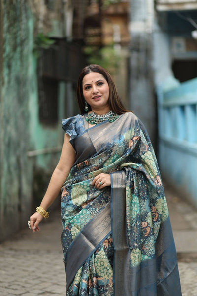 Elegant Teal Blue Banarasi Silk Saree with Forest-Inspired Motifs and Tassels