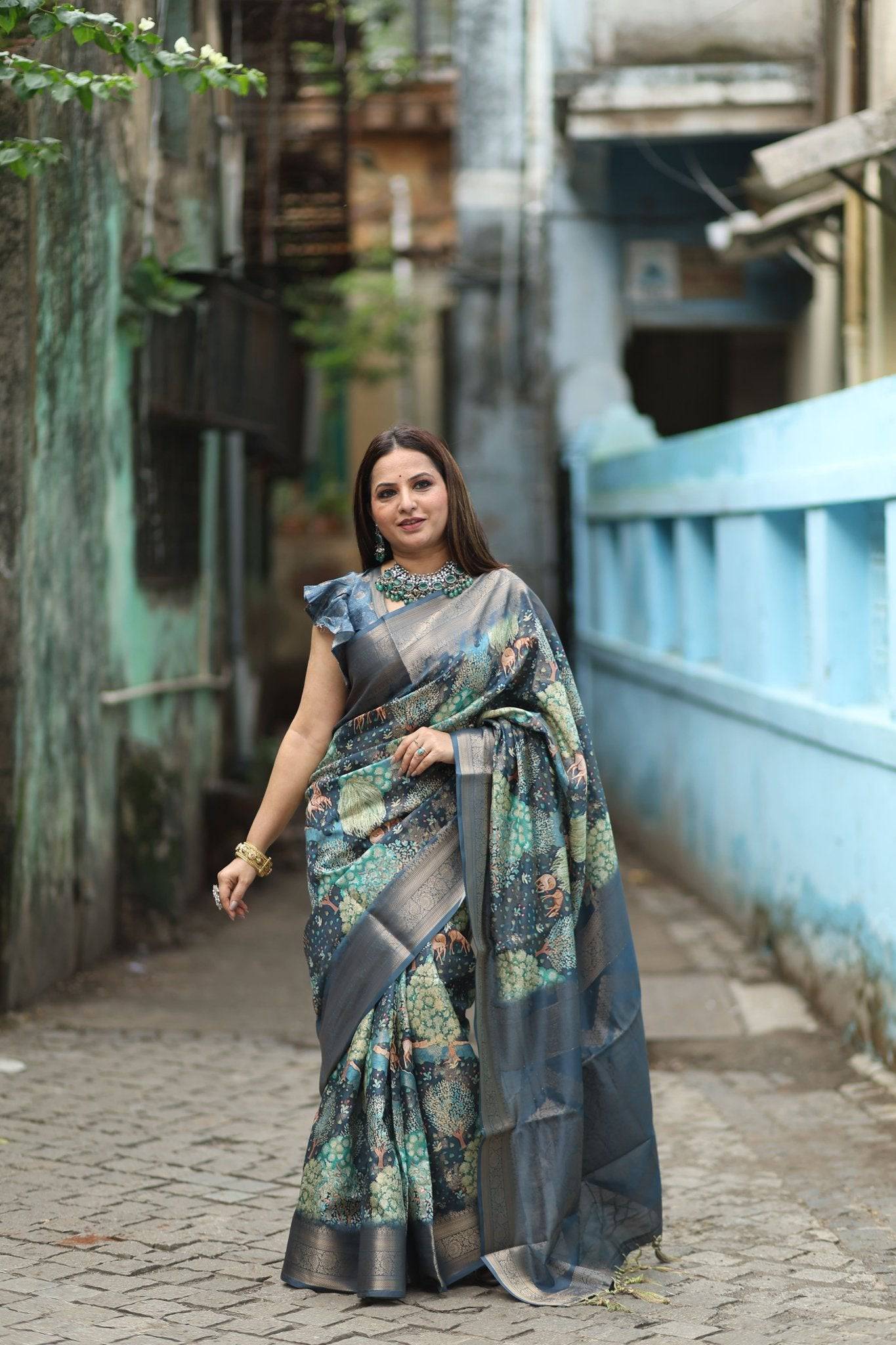 Elegant Teal Blue Banarasi Silk Saree with Forest-Inspired Motifs and Tassels