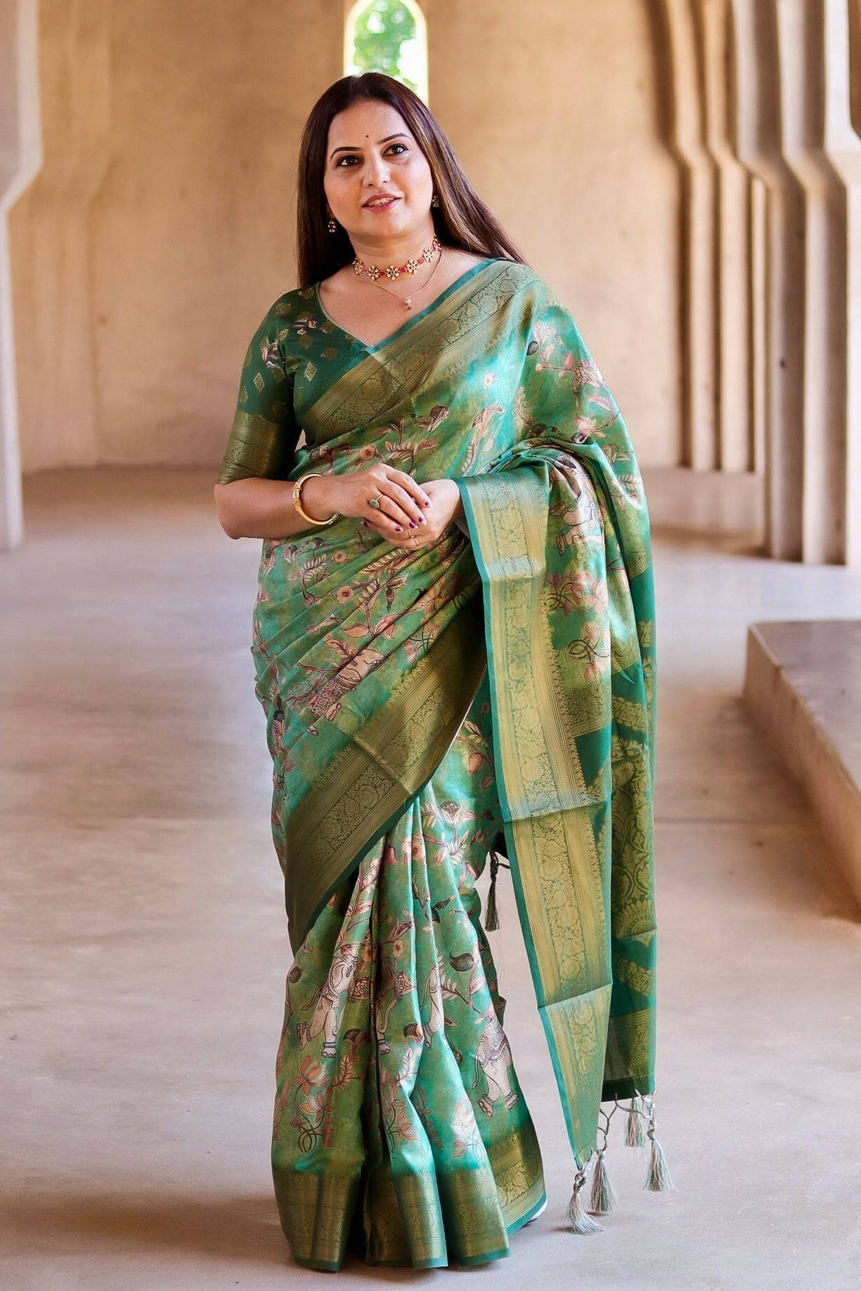 Graceful Emerald Green Banarasi Silk Saree with Floral Zari Accents