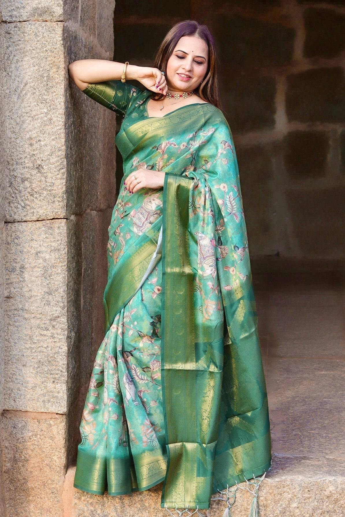 Graceful Emerald Green Banarasi Silk Saree with Floral Zari Accents