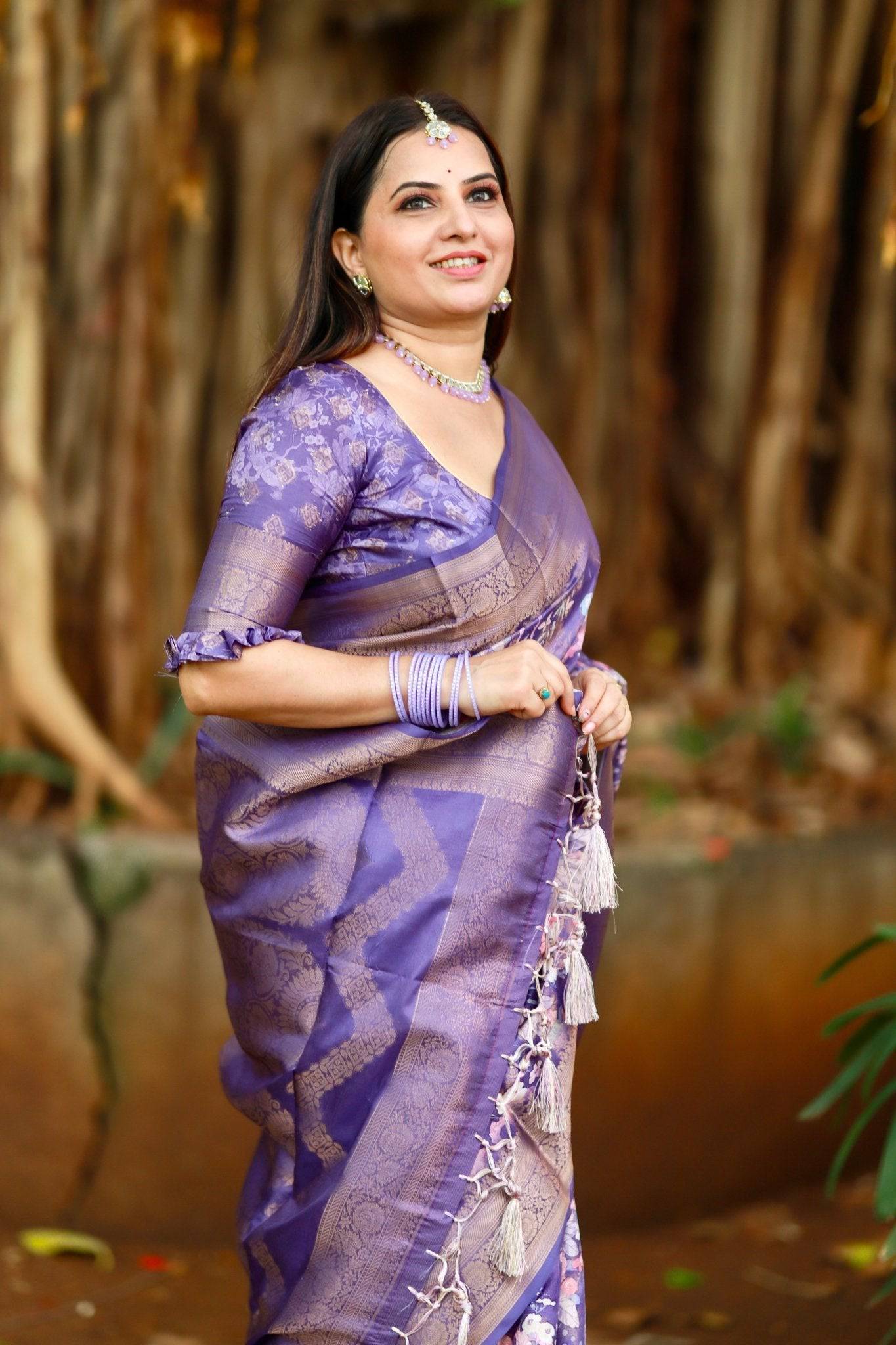 Regal Purple Banarasi Silk Saree with Floral Motifs and Elegant Tassels