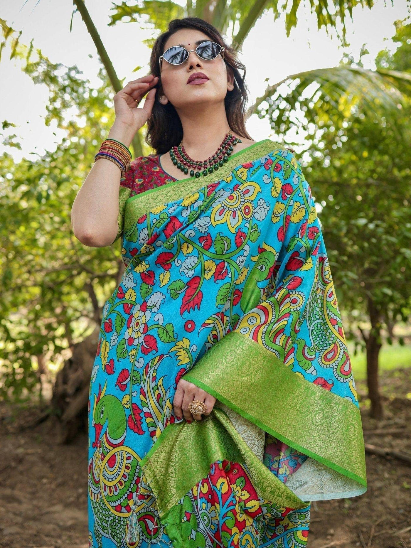 Vibrant Peacock Motif Blue and Green Banarasi Silk Saree with Zari Border