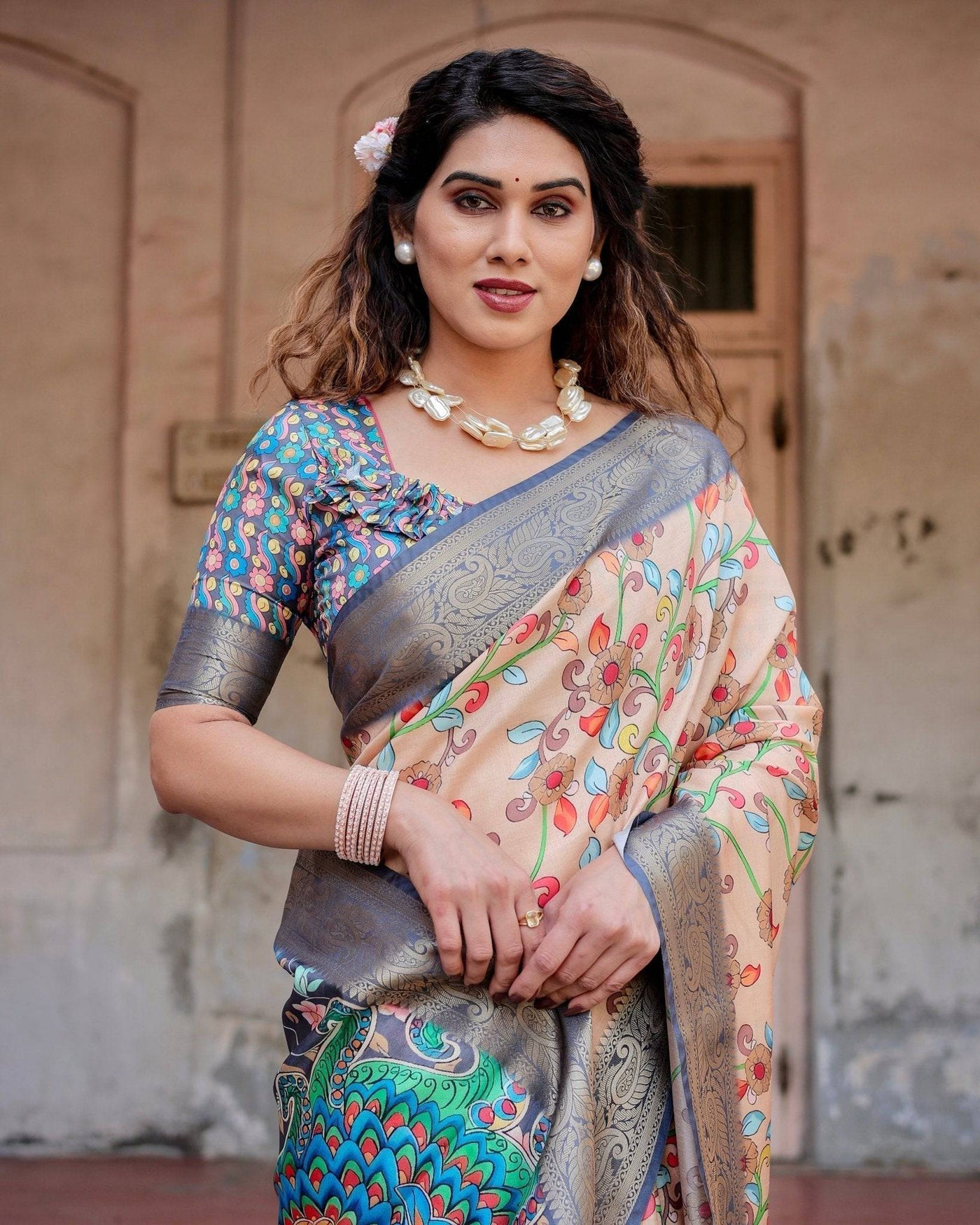 Peach and Navy Blue Floral Saree with Vibrant Peacock Pallu and Tassel Detailing