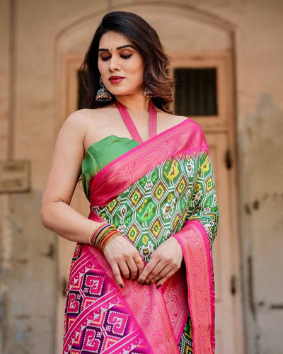 Green and Pink Banarasi Silk Saree with Vibrant Ikat Patterns and Zari Border