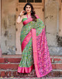 Green and Pink Tussar Silk Saree with Vibrant Ikat Patterns and Zari Border