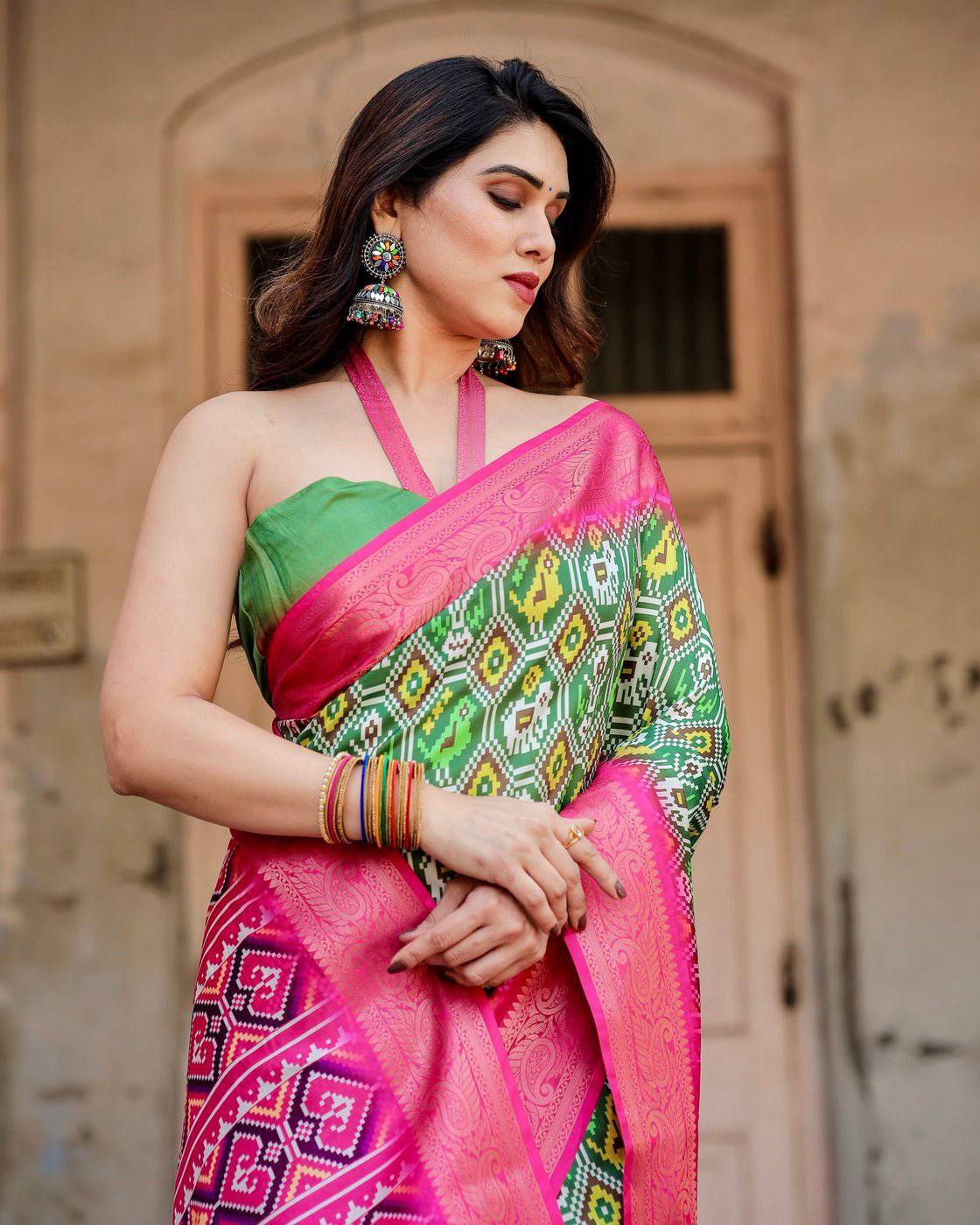 Green and Pink Tussar Silk Saree with Vibrant Ikat Patterns and Zari Border