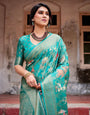 Elegant Teal Green Banarasi Silk Saree with Intricate Zari Weaving and Tassels