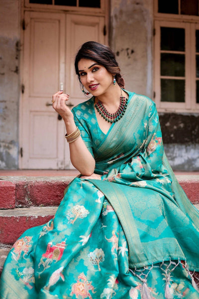 Elegant Teal Green Banarasi Silk Saree with Intricate Zari Weaving and Tassels