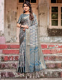 Elegant Blue and Grey Banarasi Silk Saree with Intricate Floral Patterns, Zari Woven Borders, and Tassel Accents