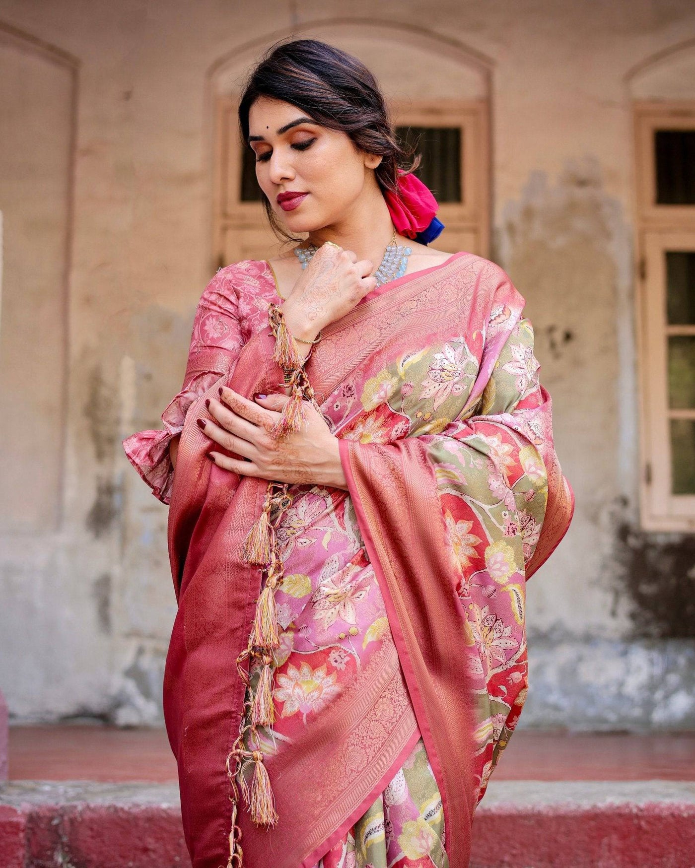 Graceful Peach and Pink Banarasi Silk Saree with Zari Weave and Tassels