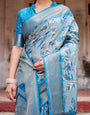 Aqua Blue Banarasi Silk Saree with Zari Border, Floral Motifs, and Tassels