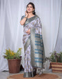 Graceful Banarasi Digitally Printed Silk Saree in Silver and Teal with Zari Work and Tassels