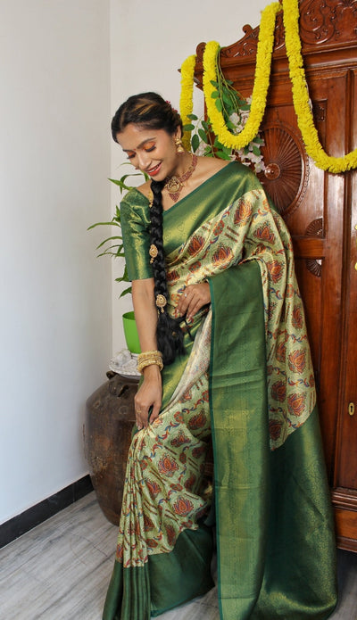 Digitally Printed Kuber Pattu Silk Saree, Exuding Regal Charm With Its Rich Pallu And Intricate Brocade Blouse, Elegantly Adorned With Enchanting Tassels On The Saree's Edge. - Almaari Fashion