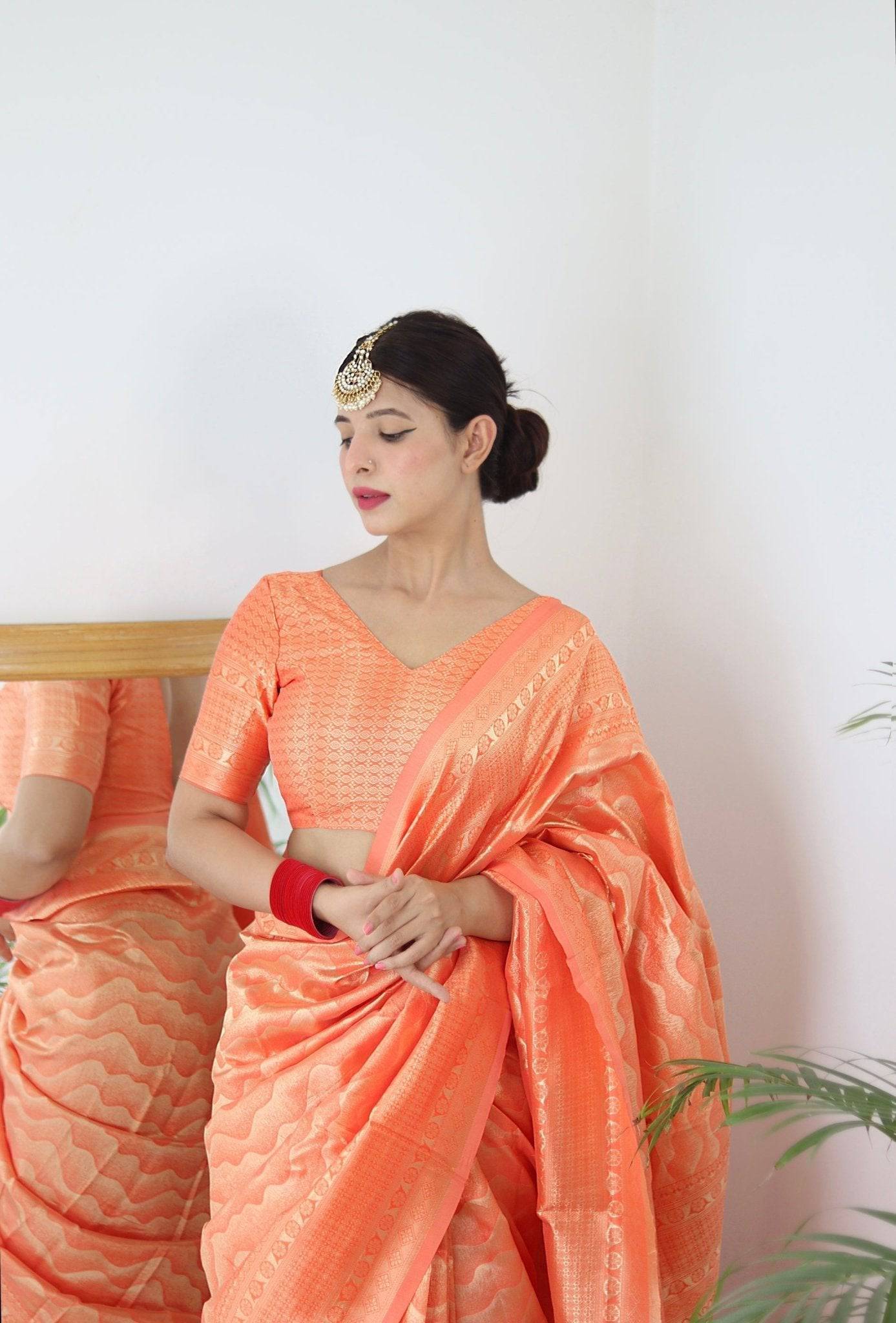 Orange Pure Kanjivaram Silk Saree With Twirling Blouse Piece