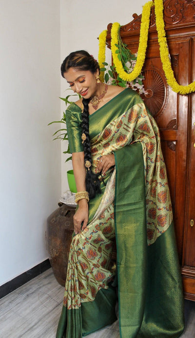 Digitally Printed Kuber Pattu Silk Saree, Exuding Regal Charm With Its Rich Pallu And Intricate Brocade Blouse, Elegantly Adorned With Enchanting Tassels On The Saree's Edge.