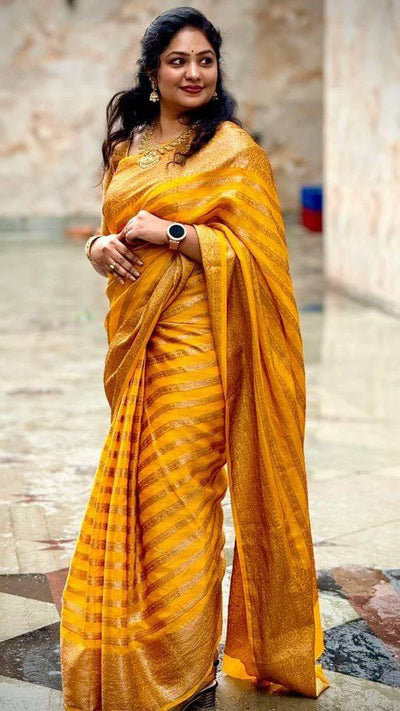 Yellow Pure Georgette Kanjivaram Silk Saree Weaved With Copper Zari Comes With Attached Blouse.