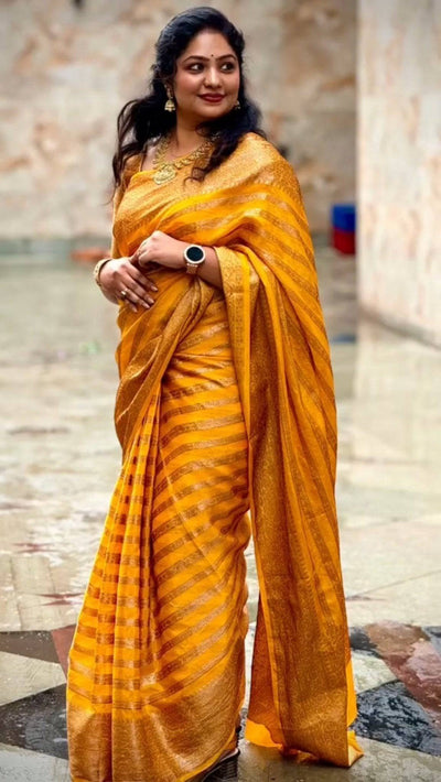 Yellow Pure Georgette Kanjivaram Silk Saree Weaved With Copper Zari Comes With Attached Blouse.