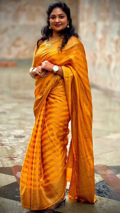 Yellow Pure Georgette Kanjivaram Silk Saree Weaved With Copper Zari Comes With Attached Blouse.