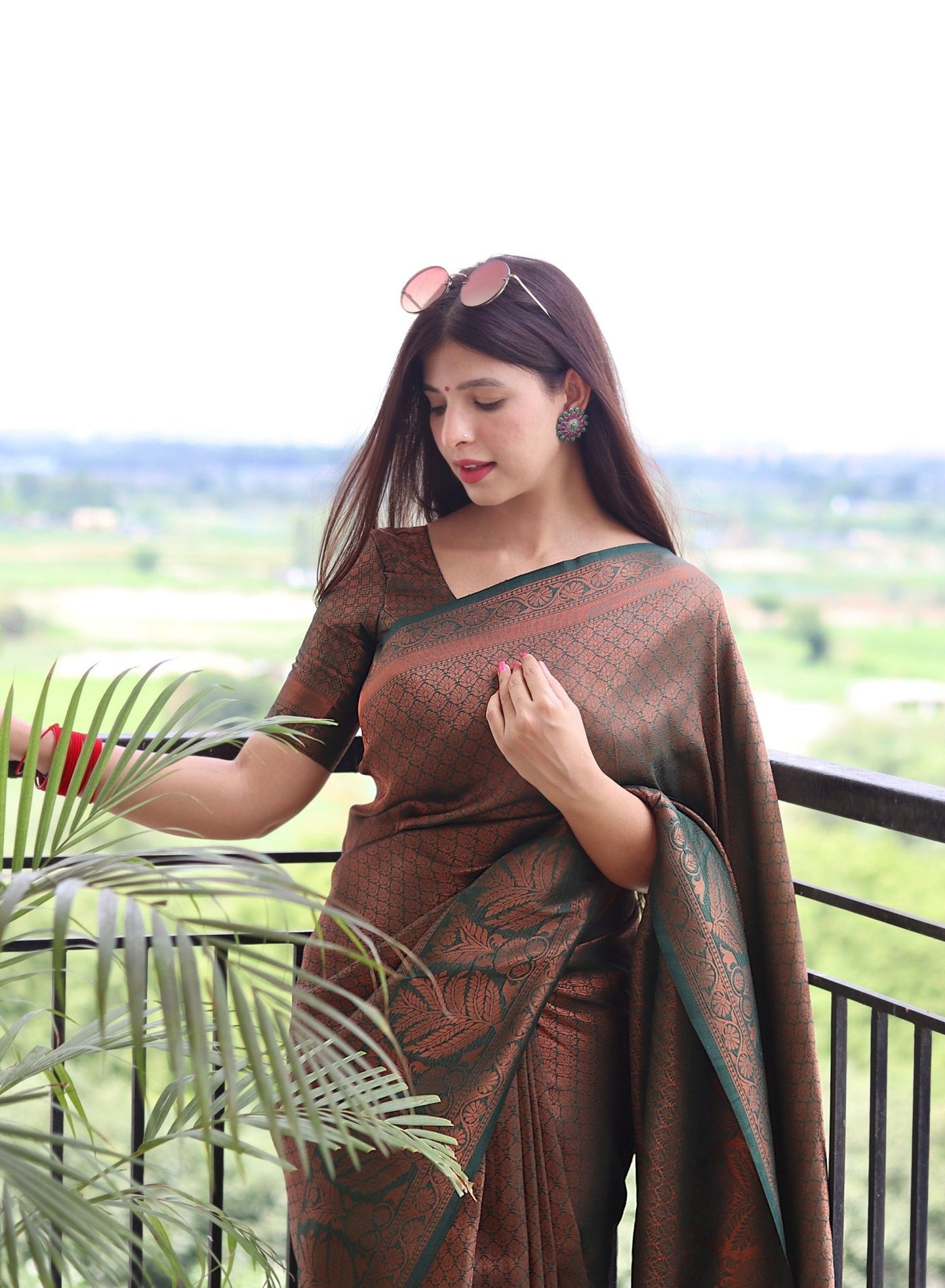 Kuber Pattu Silk Saree, Exuding Regal Charm With Its Rich Pallu And Intricate Brocade Blouse, Elegantly Adorned With Enchanting Tassels On The Saree's Edge. - Almaari Fashion