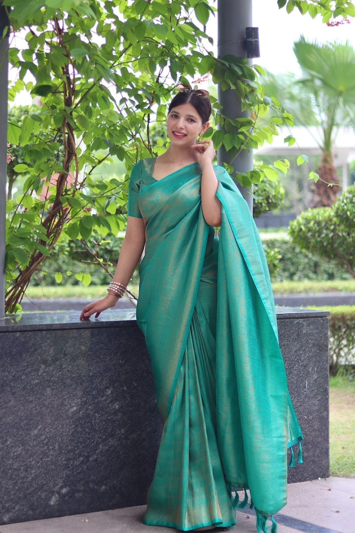 Kuber Pattu Silk Saree, Exuding Regal Charm With Its Rich Pallu And Intricate Brocade Blouse, Elegantly Adorned With Enchanting Tassels On The Saree's Edge. - Almaari Fashion