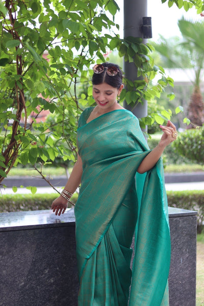 Kuber Pattu Silk Saree, Exuding Regal Charm With Its Rich Pallu And Intricate Brocade Blouse, Elegantly Adorned With Enchanting Tassels On The Saree's Edge. - Almaari Fashion